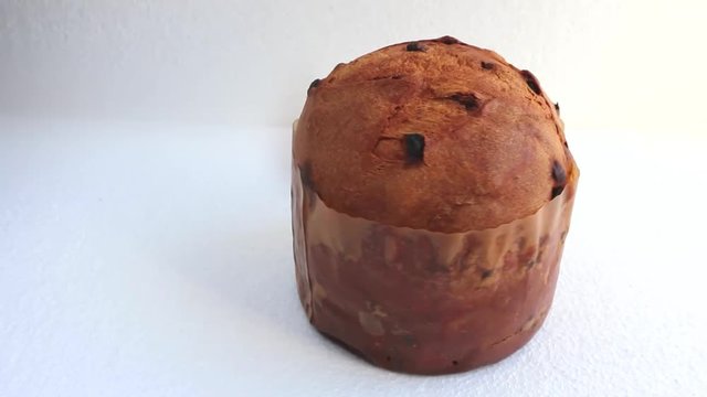 Tasty Italian holiday cake close-up  Traditional Italian milanese Christmas panettone on white or black background