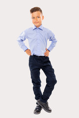 full length boy posing in studio     