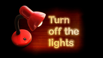 red light shines is enabled on a wooden table inscription turn off the light