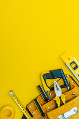 Professional tools for the master builder on a yellow background.