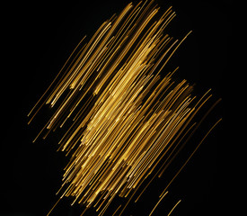 bright stripes of light moving on the black background in motion blur