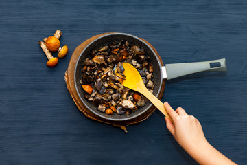 Cooking mushrooms in a pan. Fried mushrooms, boletus, orange-cap boletus.