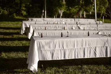 tables with candles under a tent