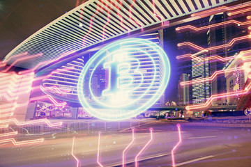 Multi exposure of cryptocurrency theme hologram drawing and city veiw background. Concept of...