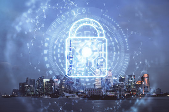 Lock icon hologram on city view with skyscrapers background multi exposure. Data security concept.