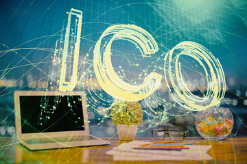 Double exposure of blockchain and crypto economy theme hologram and table with computer background. Concept of bitcoin cryptocurrency.