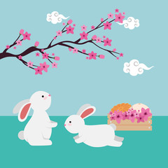 Obraz na płótnie Canvas rabbits couple with chinese tree branch and flowers