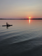 Sunset on the water. Evening kayak ride