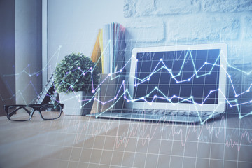 Multi exposure of graph and financial info and work space with computer background. Concept of...