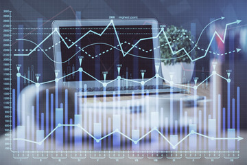 Forex market chart hologram and personal computer background. Multi exposure. Concept of investment.