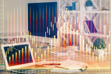 Financial graph colorful drawing and table with computer on background. Multi exposure. Concept of international markets.