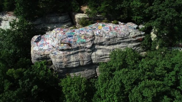 Graffiti Rock in rural forest, aerial