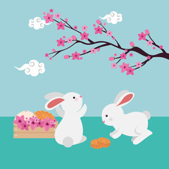 rabbits couple with chinese tree branch and flowers