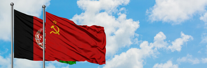Afghanistan and Soviet Union flag waving in the wind against white cloudy blue sky together....