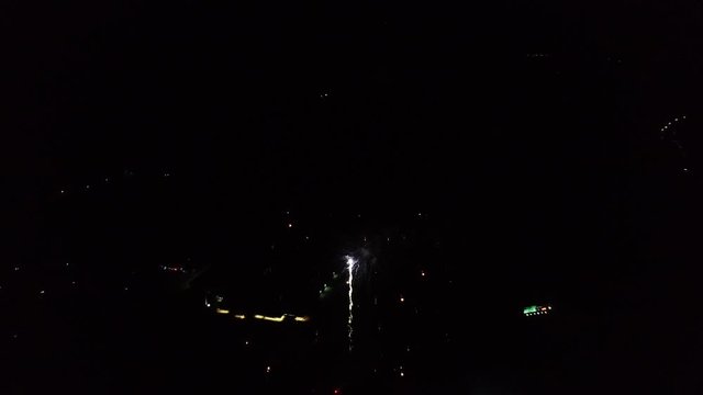 Colorful fireworks at night, wide aerial