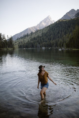woman in lake at grand teton national park