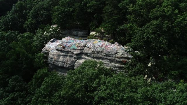 Panning aerial, Graffiti Rock in rural Kentucky