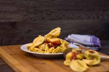 Plate of meat ravioli with tomato