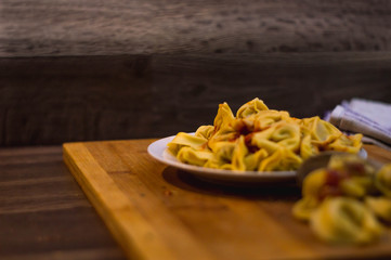 Plate of meat ravioli with tomato