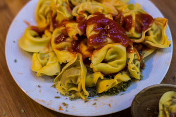 Plate of meat ravioli with tomato