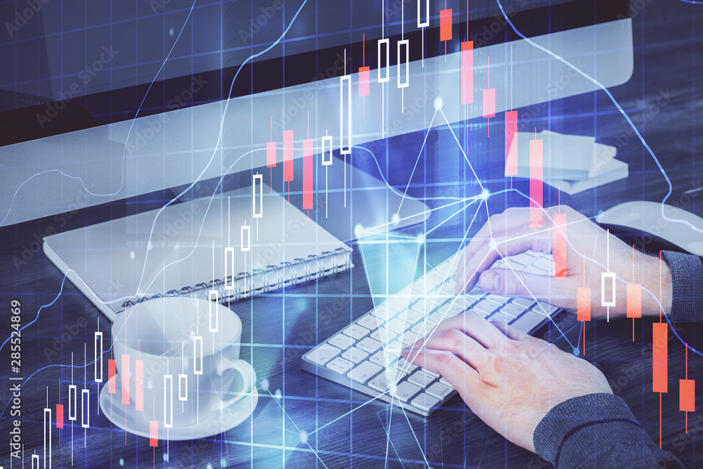 Poster Multi exposure of graph with man typing on computer in office on background. Concept of hard work.