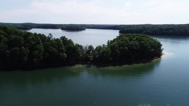 Forest shoreline in Laurel River Lake, wide aerial
