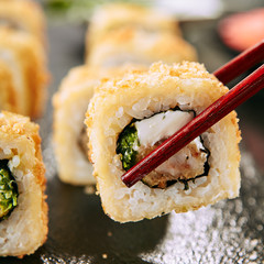 Crispy Ebi Tempura Maki Sushi Rolls or Uramaki with King Prawn © Ryzhkov
