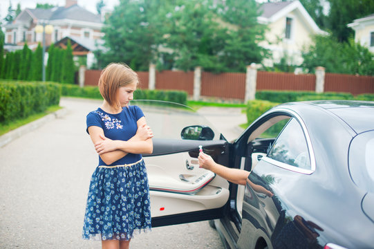 A strange dangerous man in car try to kidnap toddler lonely scared girl with candy