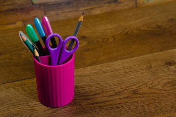 High angle of colorful school supplies on table in modern workplace showing back to school concept 