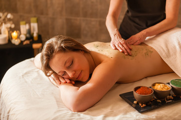 Obraz na płótnie Canvas Beautiful young woman receiving a massage.