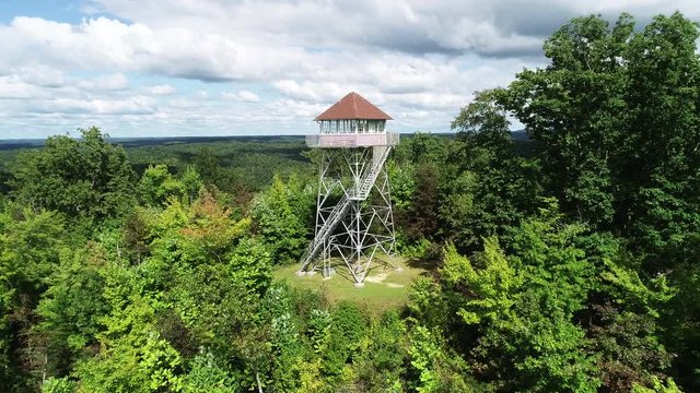 Pinnacle Knob Fire Tower in woodland landscape, aerial