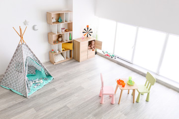 Interior of modern children's room with toys