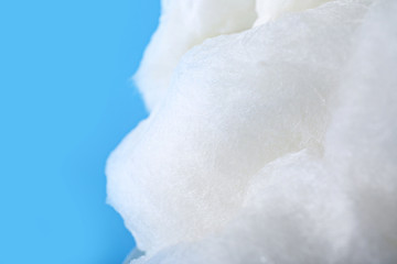 Tasty cotton candy on color background, closeup