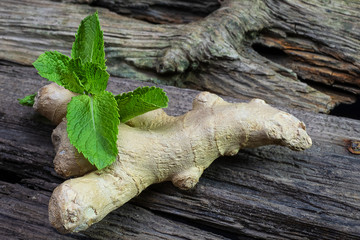 ginger and mint on an old wooden background