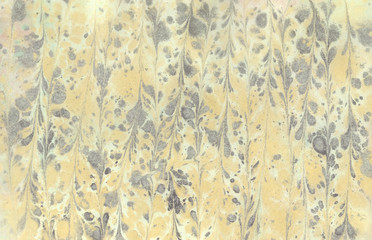 Marbled texture in yellow gray.  Background. Wallpaper.