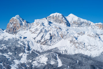 Fototapeta na wymiar Tofana Peak Mountain Range in Winter, Covered with Snow, in the Italian Dolomites, Famous Skiing Resort Cortina d Ampezzo, Italy