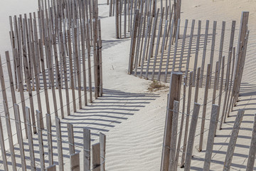 Wooden fence at a windy and sandy beach, Long Beach, New York