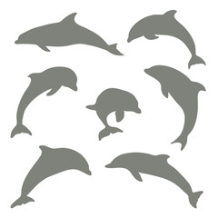 Set of dolphins silhouettes, vector