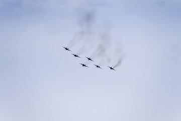 Air show in the sky above the Krasnodar airport flight school. Airshow in honor of Defender of the Fatherland. MiG-29 in the sky.