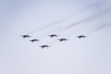 Air show in the sky above the Krasnodar airport flight school. Airshow in honor of Defender of the Fatherland. MiG-29 in the sky.