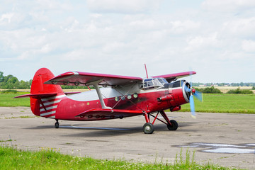 Obraz na płótnie Canvas historical single engine airplane Antonov AN2, starting the engine