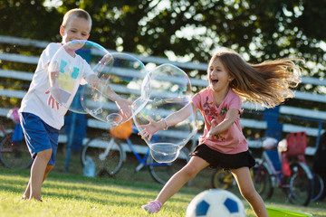 joyful children soap bubbles