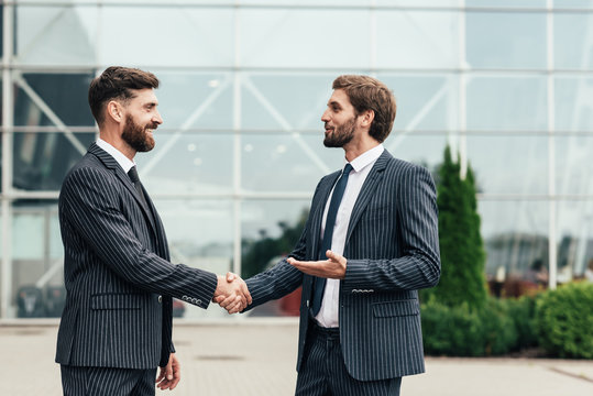 Image two business partners in elegant suit successful handshake together.Partnership approval and thanks gesture concept