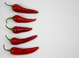 Red peppers food background. Peppers on a white background. Vegetarian food. Hot peppers. Vegetable food. Food Red pepper isolate. Copyspace