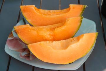 Three pieces of melon cut for lunch