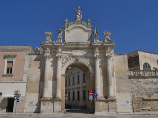 Lecce - Rudiae Gate. It is one of the ancient entrance in the city and it was built in baroque style. In its facade take place st Oronzo statue and hight columns  supporting the statues of  st Oronzo,