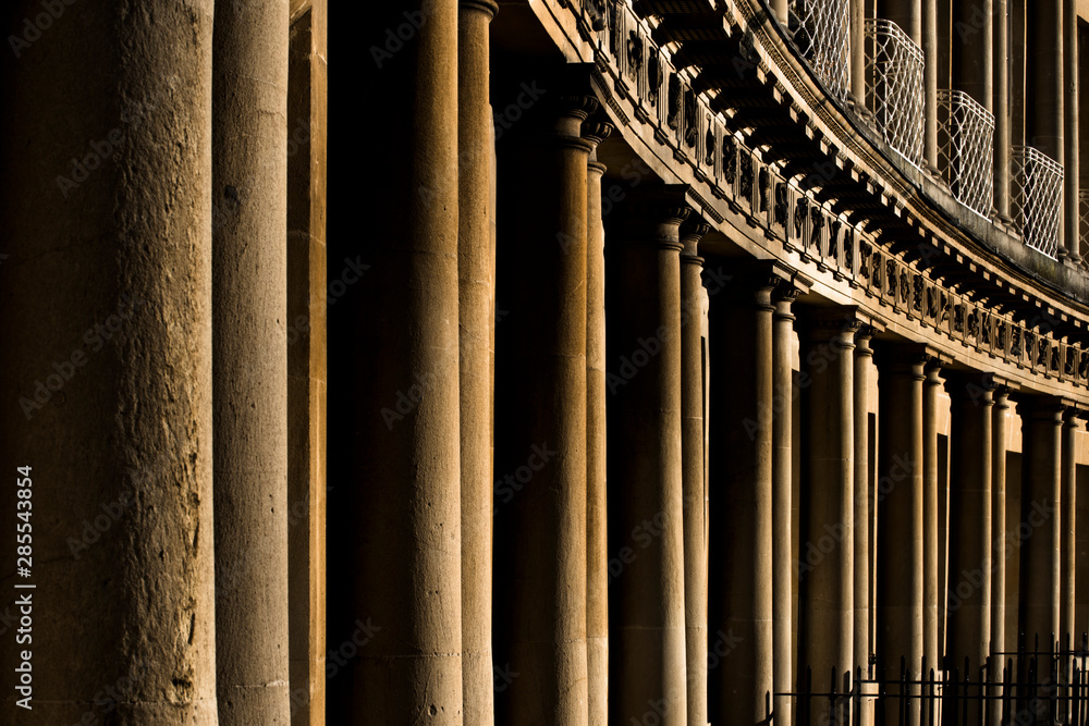 Wall mural Long shot of the circular street known as the Circus in Bath, England.  it was built between 1754 and 1768, and is regarded as a pre-eminent example of Georgian architecture