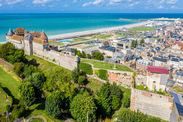 Aerial view of Dieppe town, the fishing port on the English Channel, at the mouth of Arques river. On a clifftop overlooking pebbly Dieppe Beach is the centuries-old Chateau de Dieppe, now the museum - obrazy, fototapety, plakaty