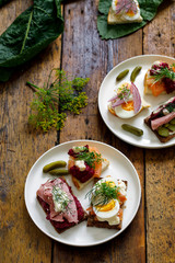 Selection of Scandinavian open sandwiches with beef, beetroot and egg