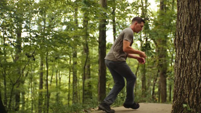Man drives disc golf disc, long shot, slow motion